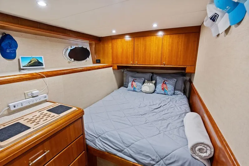 Picosa Lady Yacht Photos Pics Cozy bedroom in 2001 West Bay 103 Sonship yacht with wood cabinetry and plush bedding.