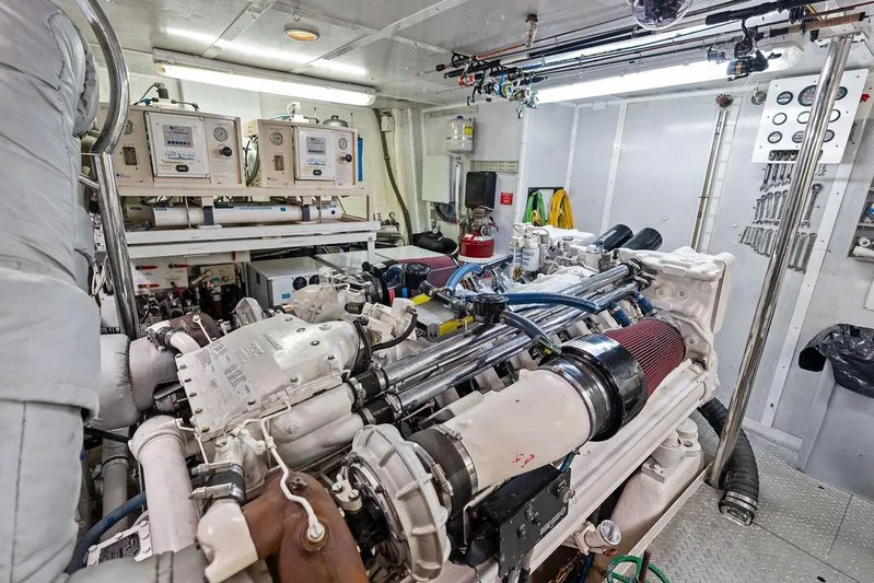 Picosa Lady Yacht Photos Pics Engine room of 2001 West Bay 103 Sonship yacht, showcasing machinery and equipment.