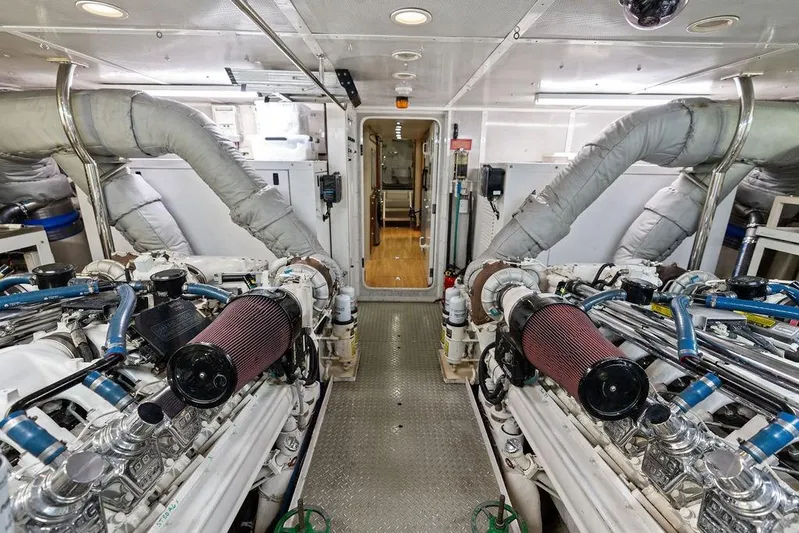 Picosa Lady Yacht Photos Pics Engine room of 2001 West Bay 103 Sonship yacht, featuring dual engines and insulated piping.