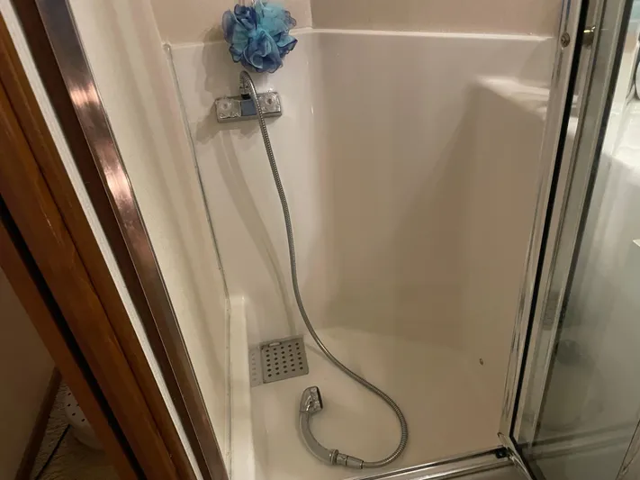 "harmony" Yacht Photos Pics Shower area in 1995 Bayliner 4788 Pilot House Motoryacht with handheld showerhead.