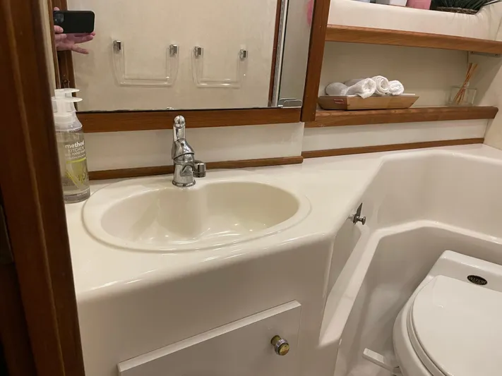 "harmony" Yacht Photos Pics Bathroom interior of 1995 Bayliner 4788 Pilot House Motoryacht with sink and toilet.