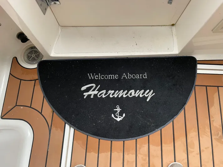 "harmony" Yacht Photos Pics Welcome mat on 1995 Bayliner 4788 Pilot House Motoryacht, "Harmony," with anchor design.