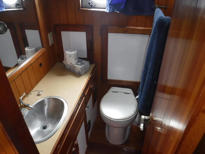 " Loon Point " Yacht Photos Pics Bathroom interior of 1986 Custom 48 Trawler with sink and toilet.