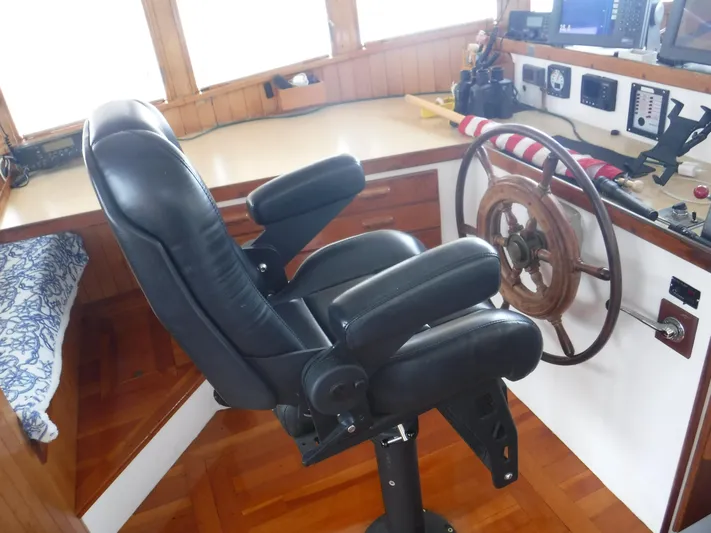 " Loon Point " Yacht Photos Pics Captain's chair and helm in 1986 Custom 48 Trawler boat interior.
