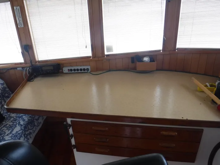" Loon Point " Yacht Photos Pics Interior of 1986 Custom 48 Trawler with wooden desk and radio equipment.