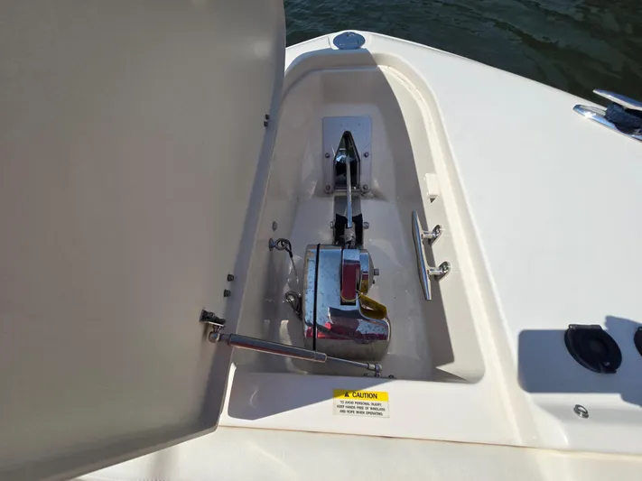  Yacht Photos Pics Anchor compartment of 2017 Grady-White Freedom 335 boat, open lid, showing anchor mechanism.