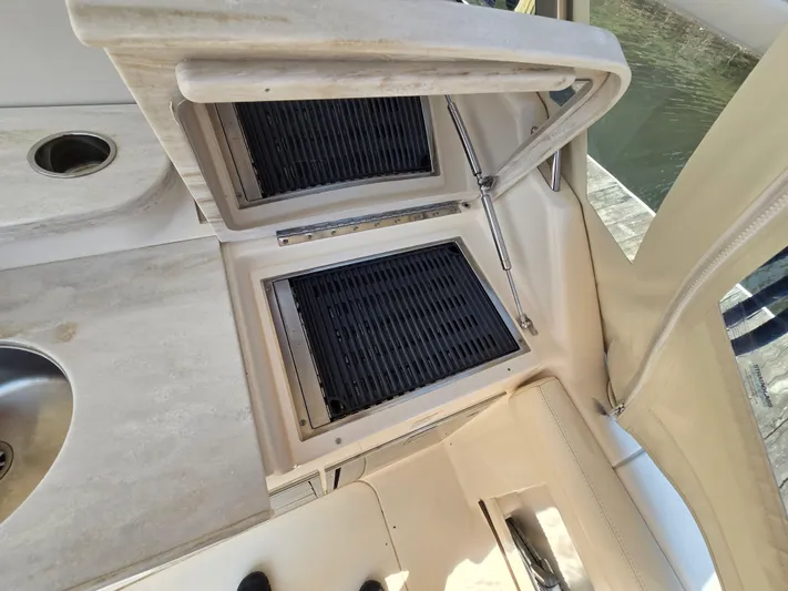  Yacht Photos Pics Outdoor grill and sink on 2017 Grady-White Freedom 335 boat deck.