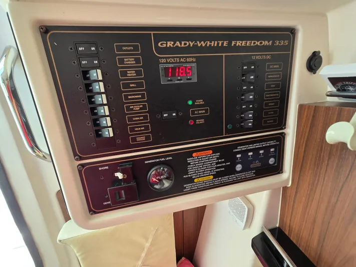  Yacht Photos Pics Control panel of 2017 Grady-White Freedom 335 boat, showing electrical switches and fuel gauge.