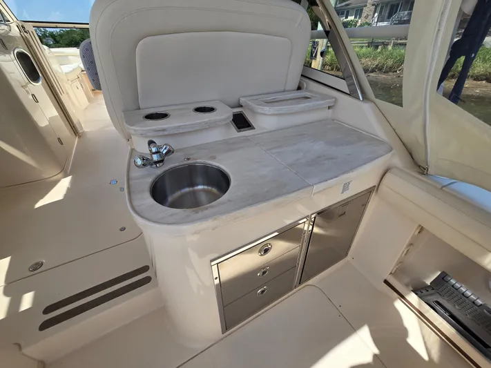  Yacht Photos Pics 2017 Grady-White Freedom 335 boat interior with sink and storage cabinets.