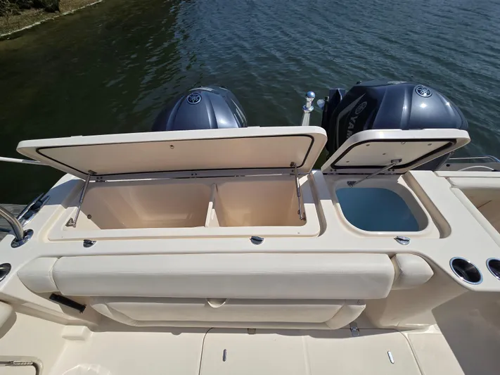  Yacht Photos Pics 2017 Grady-White Freedom 335 boat with open storage compartments and dual Yamaha engines.