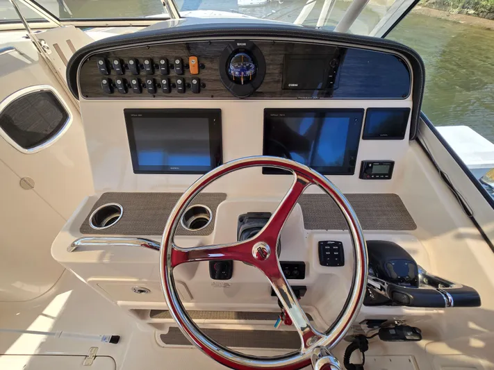  Yacht Photos Pics 2017 Grady-White Freedom 335 helm with steering wheel and control panels.