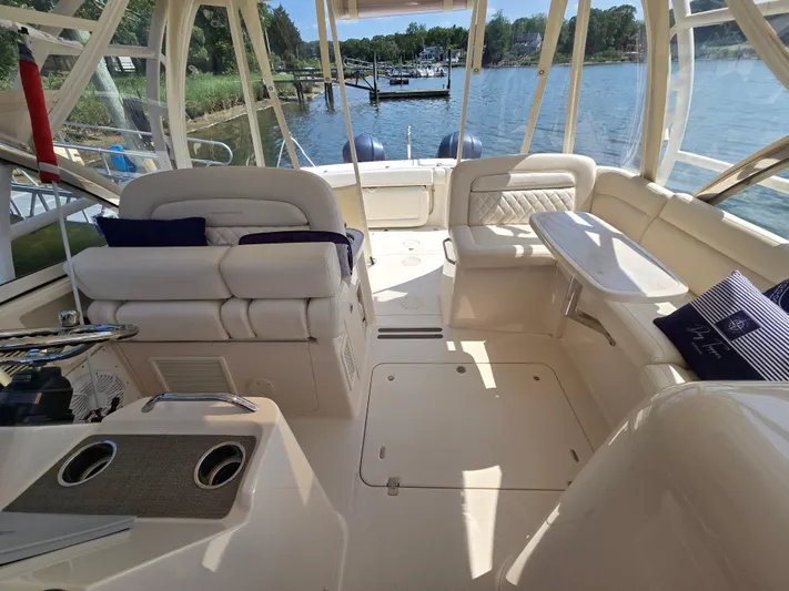  Yacht Photos Pics 2017 Grady-White Freedom 335 boat interior with seating and water view.