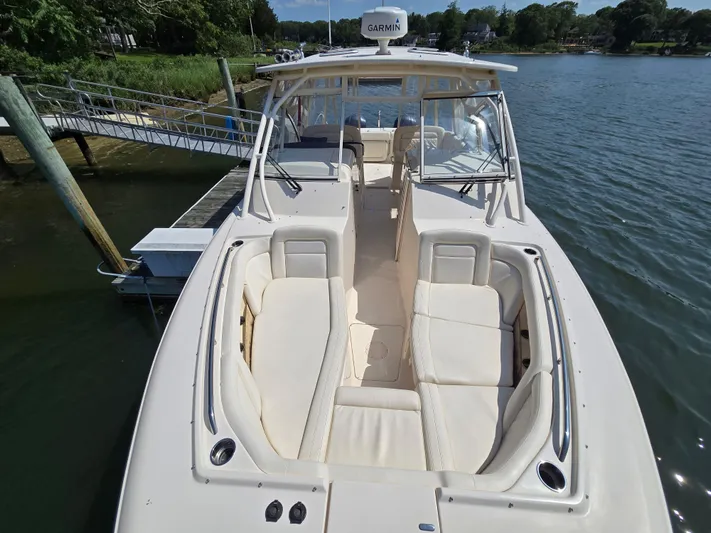 Yacht Photos Pics 2017 Grady-White Freedom 335 boat docked, featuring spacious seating and Garmin equipment.