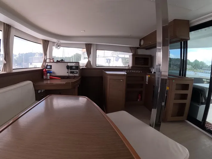 Oceanfront Yacht Photos Pics Interior of 2019 Lagoon 42 catamaran with modern kitchen and dining area.