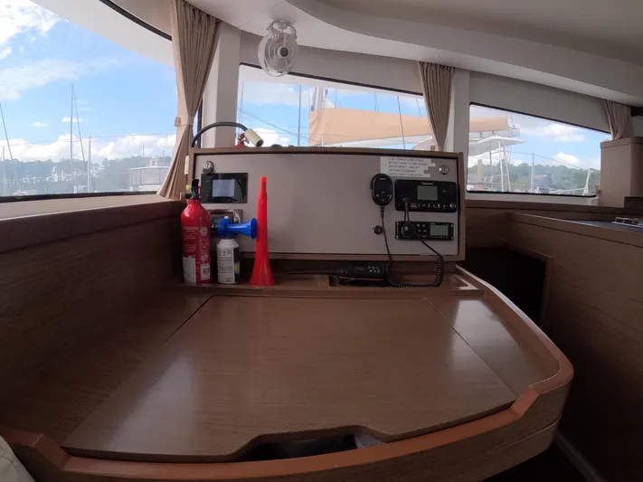 Oceanfront Yacht Photos Pics Interior of 2019 Lagoon 42 yacht with navigation station and equipment.
