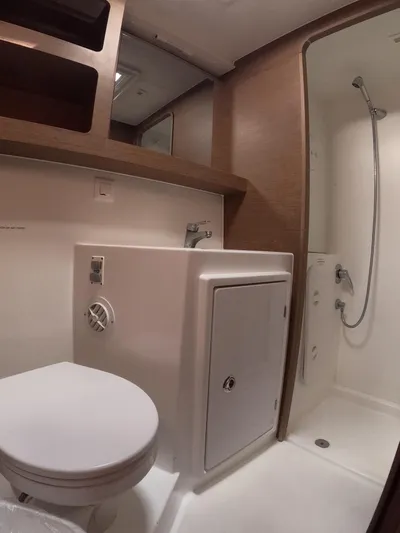 Oceanfront Yacht Photos Pics 2019 Lagoon 42 yacht bathroom with shower, sink, and toilet.