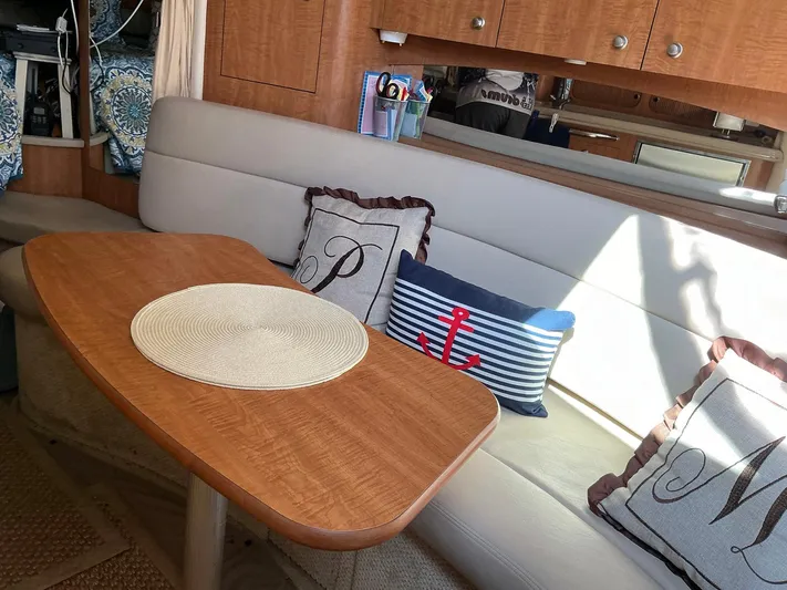 Sapphire N Rhythm Yacht Photos Pics Interior of 2006 Sea Ray 340 Sundancer with cozy seating and nautical-themed pillows.