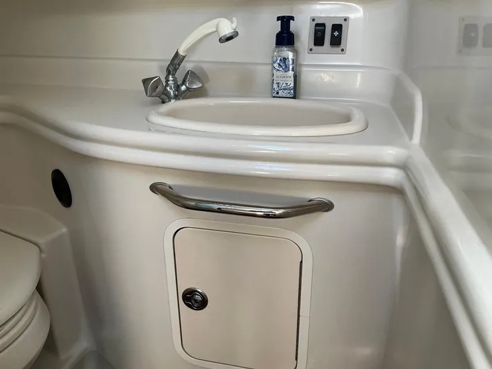 Sapphire N Rhythm Yacht Photos Pics 2006 Sea Ray 340 Sundancer bathroom sink with faucet and soap dispenser.