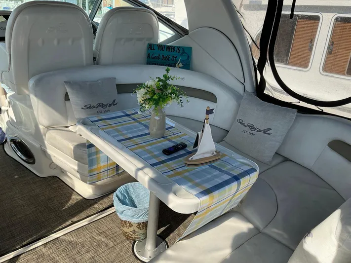 Sapphire N Rhythm Yacht Photos Pics Interior of 2006 Sea Ray 340 Sundancer with cozy seating and nautical decor.
