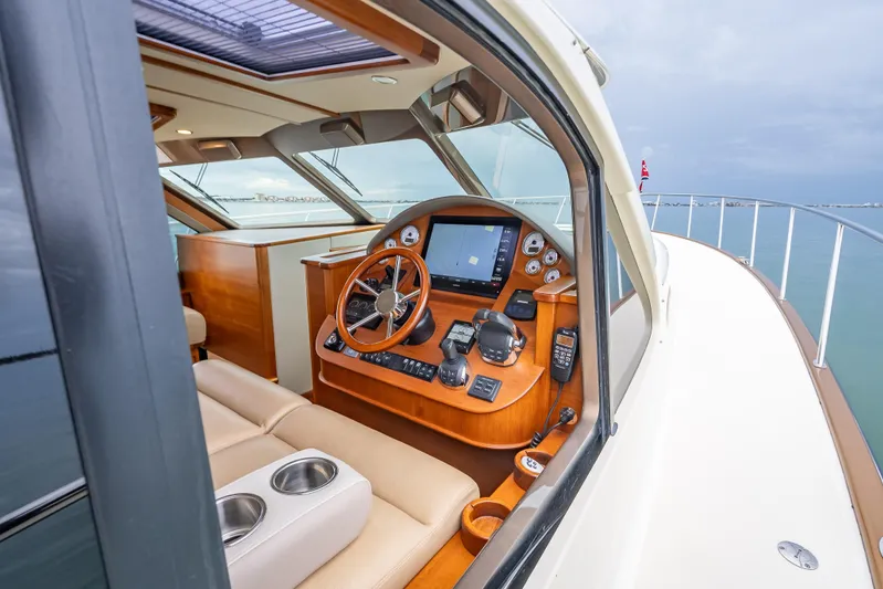 Date Night Yacht Photos Pics Interior view of 2020 Palm Beach Motor Yachts PB50 helm with navigation controls.