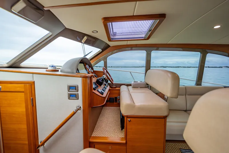 Date Night Yacht Photos Pics Interior of 2020 Palm Beach Motor Yachts PB50, featuring luxurious seating and elegant wood finishes.