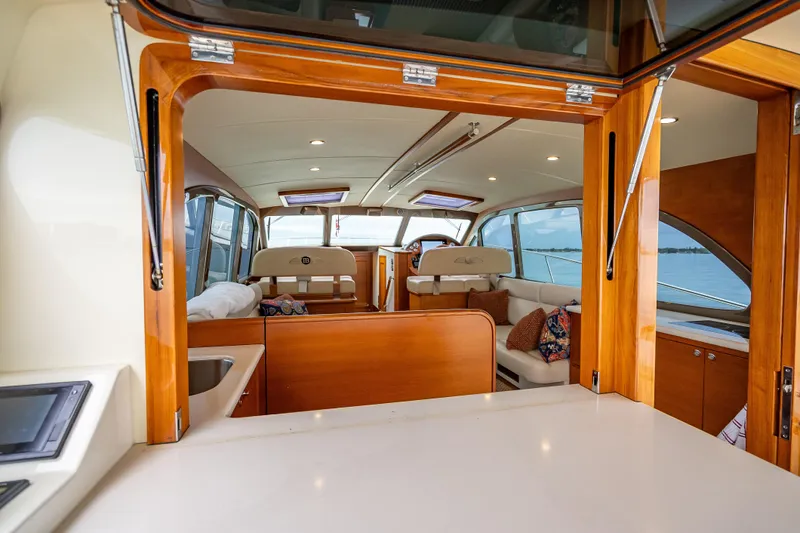 Date Night Yacht Photos Pics Luxurious interior of 2020 Palm Beach Motor Yachts PB50, featuring elegant wood finishes.