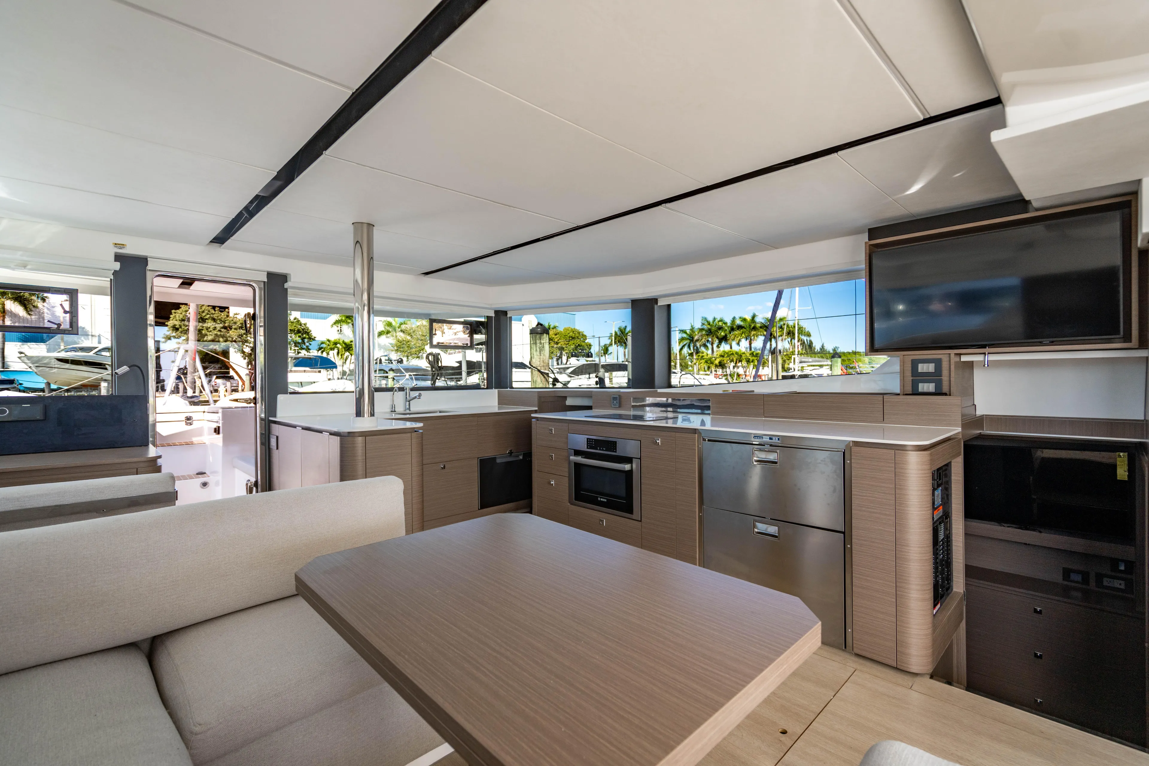 C1022 Yacht Photos Pics Luxurious interior of 2025 Leopard 46 yacht with modern kitchen and seating area.