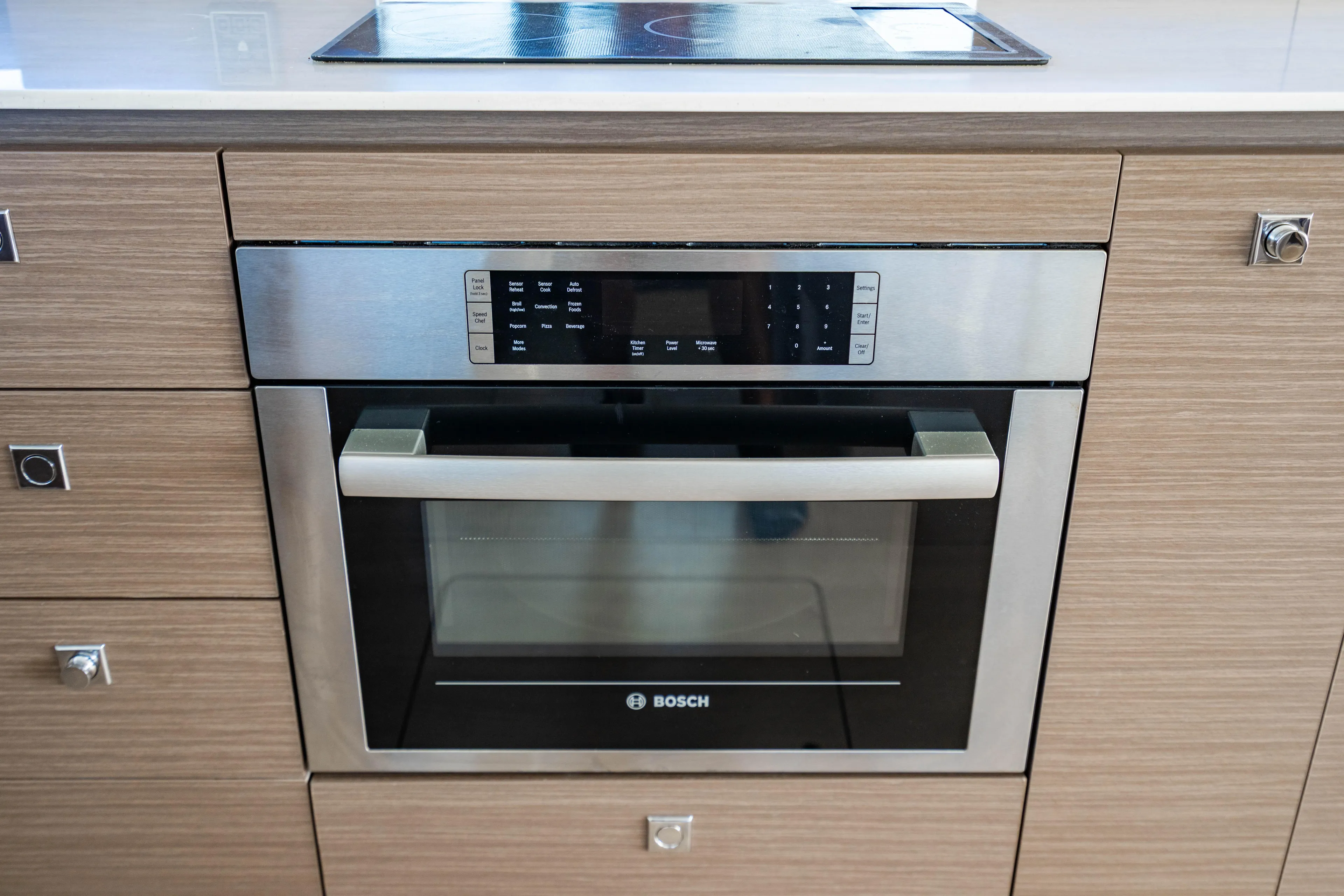 C1022 Yacht Photos Pics Modern Bosch oven in sleek wooden kitchen cabinetry, Leopard 46 model, 2025.