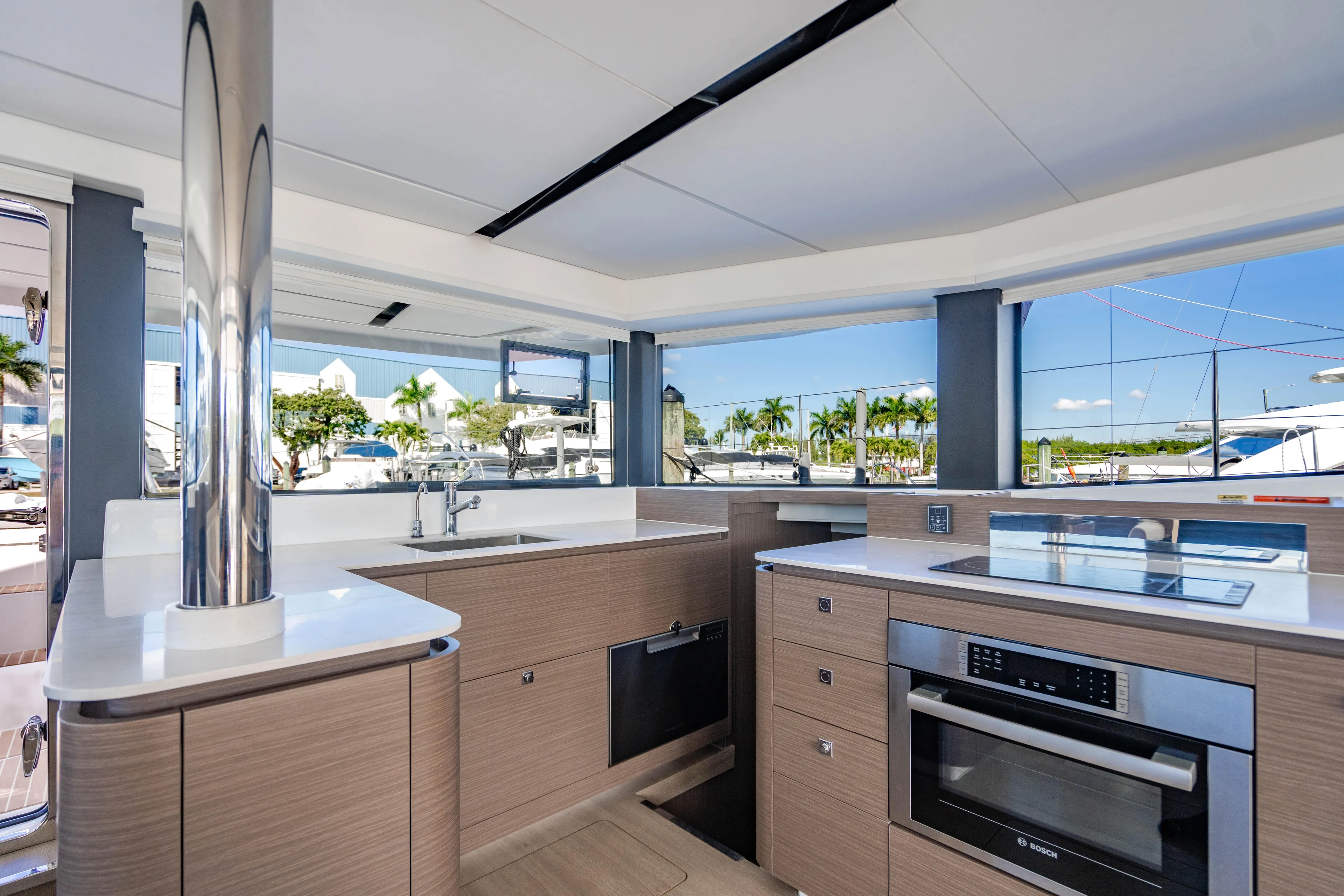 C1022 Yacht Photos Pics Modern kitchen interior on 2025 Leopard 46 yacht, featuring sleek design and appliances.