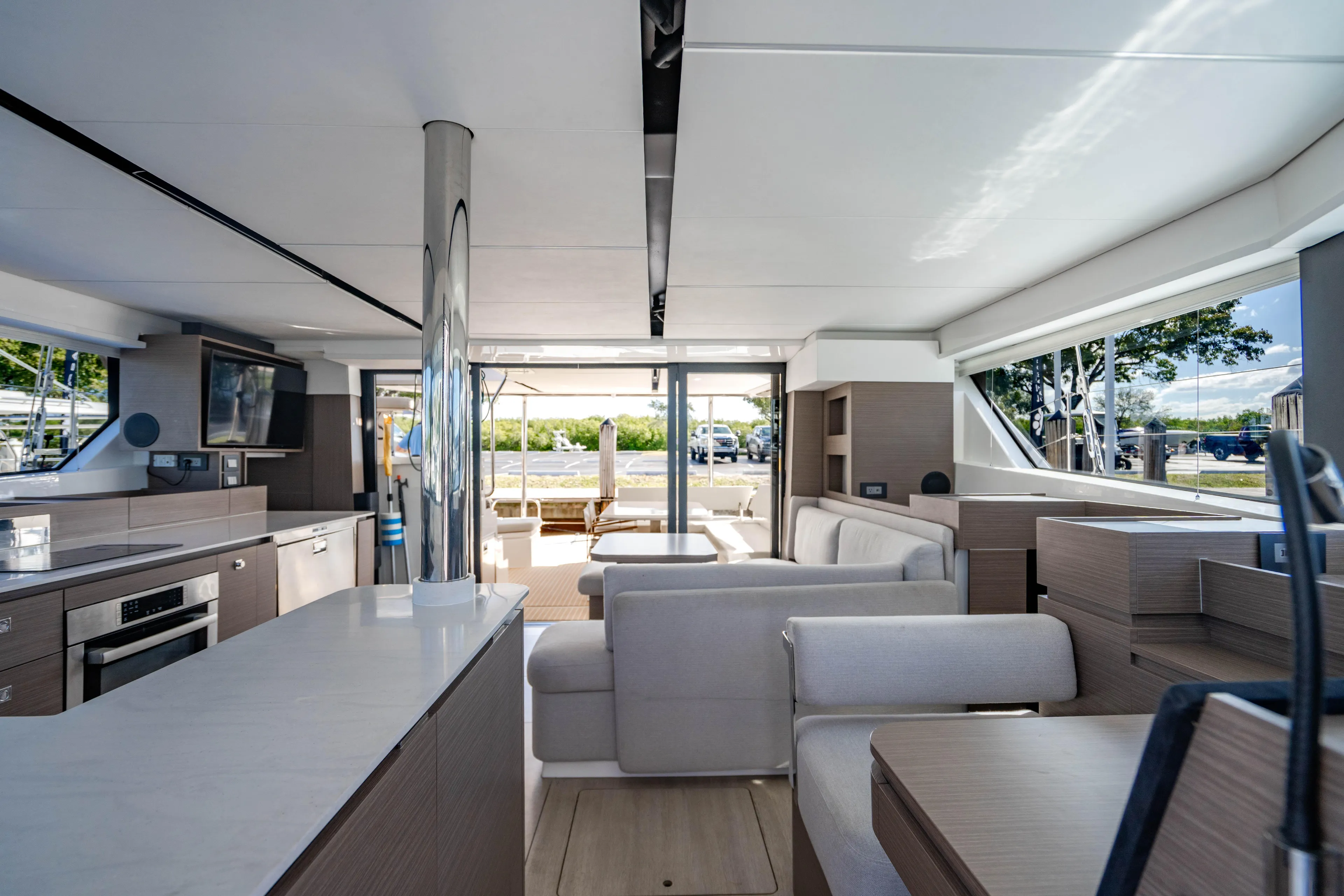 C1022 Yacht Photos Pics Luxurious interior of 2025 Leopard 46 yacht with modern furnishings and panoramic windows.