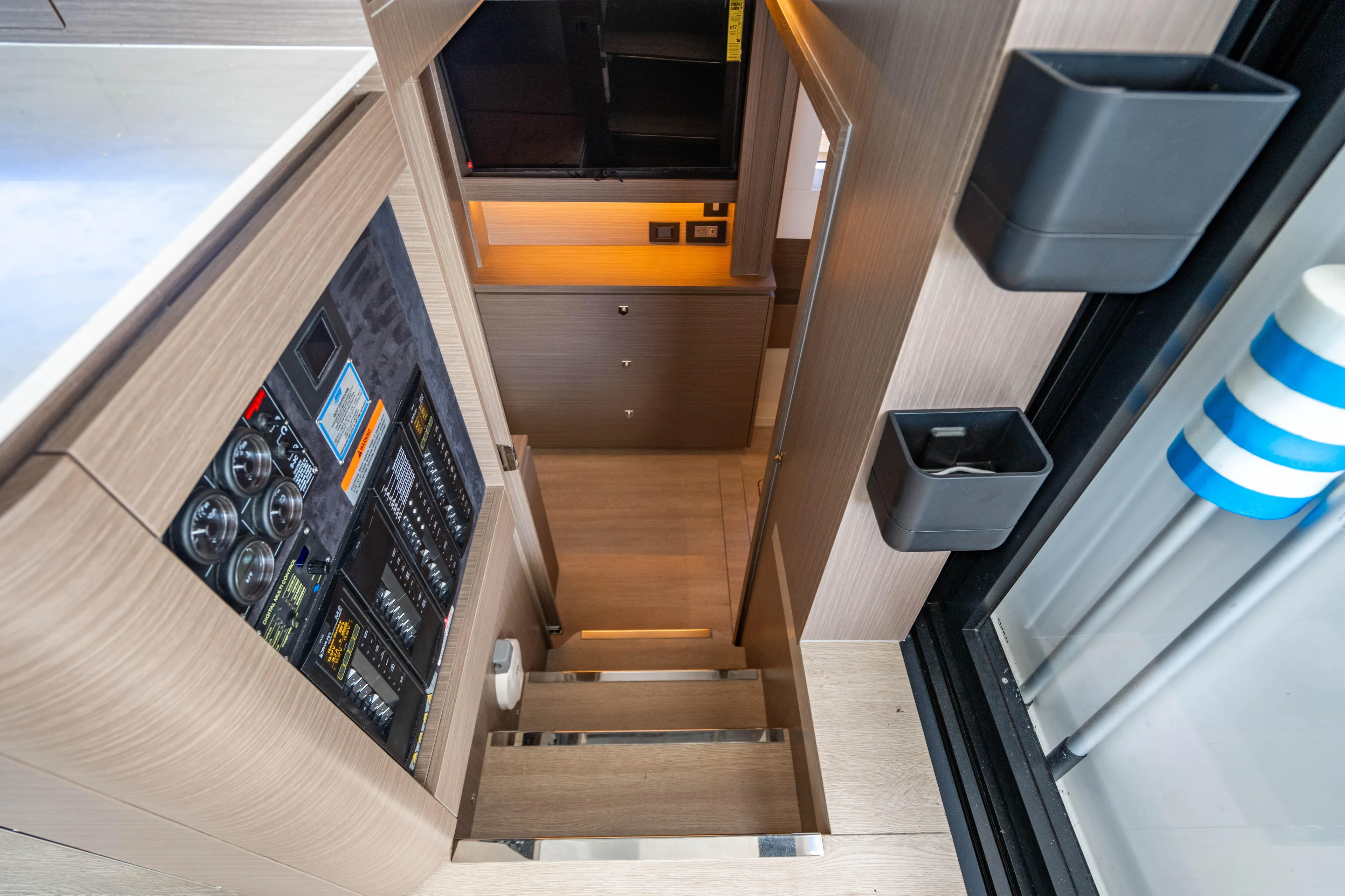 C1022 Yacht Photos Pics Interior of 2025 Leopard 46 yacht, featuring modern stairs and control panel.