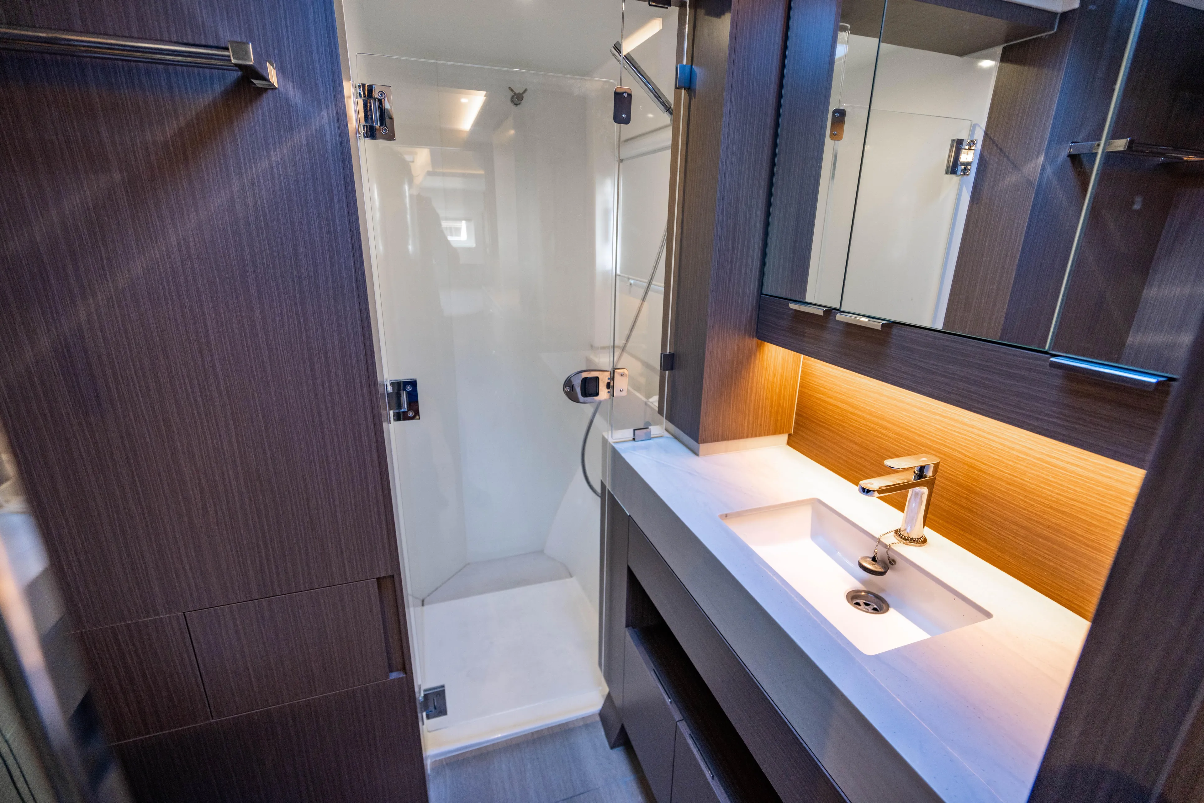 C1022 Yacht Photos Pics Modern bathroom in 2025 Leopard 46 yacht with sleek design and ambient lighting.
