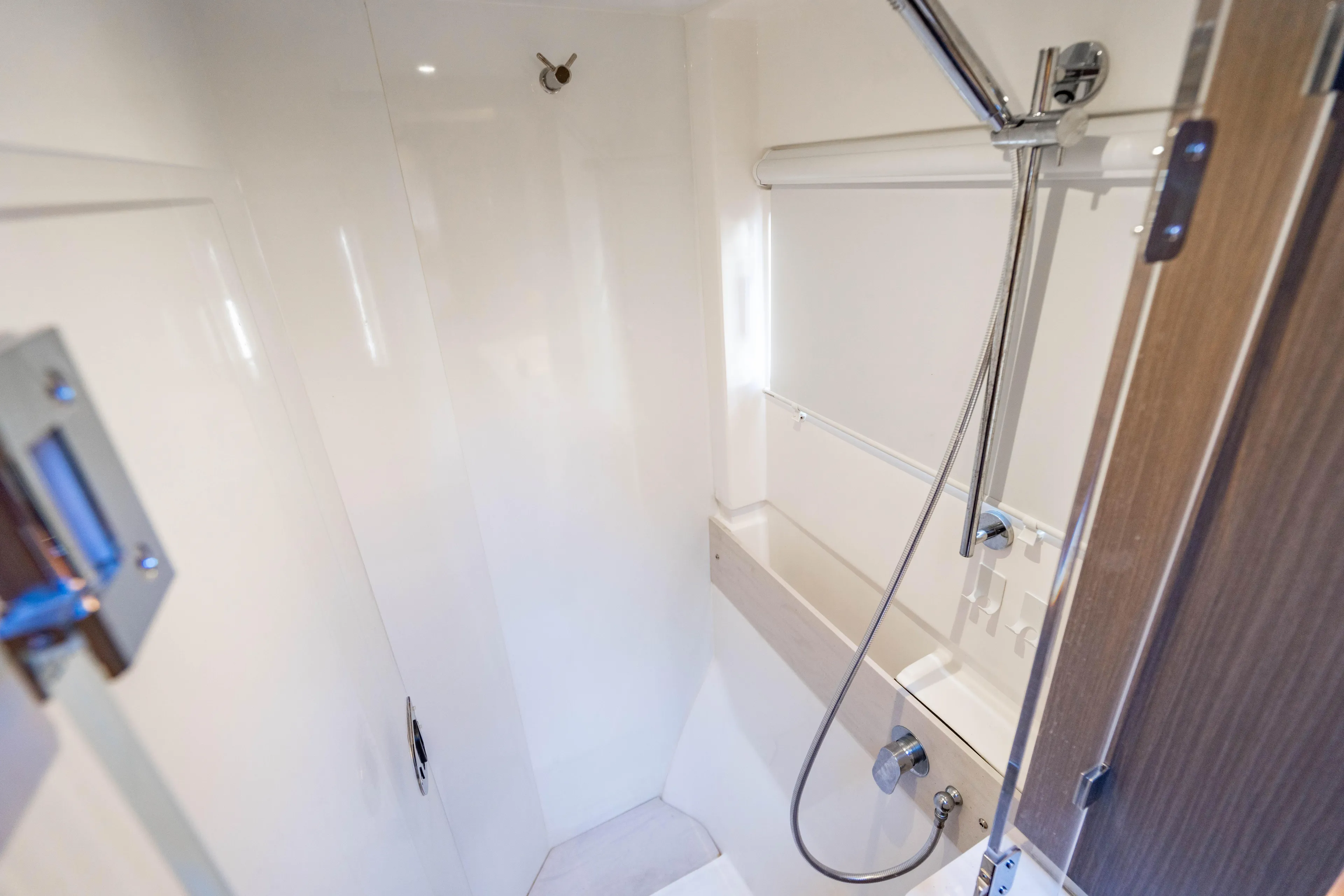 C1022 Yacht Photos Pics Modern shower area in 2025 Leopard 46 yacht, featuring sleek design and chrome fixtures.