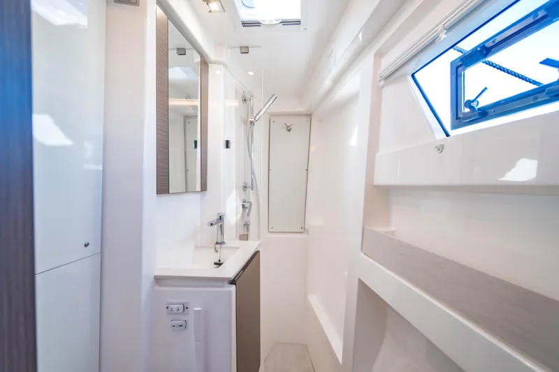 C1022 Yacht Photos Pics Modern bathroom interior on a 2025 Leopard 46 yacht, featuring sleek design and ample natural light.