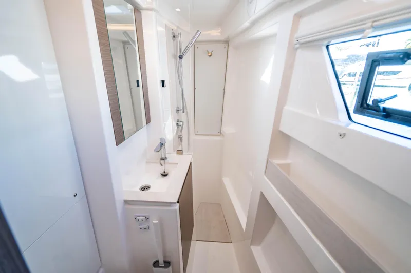 C1022 Yacht Photos Pics Modern bathroom interior of 2025 Leopard 46 yacht with sleek design and window view.