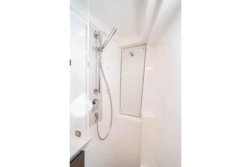 C1022 Yacht Photos Pics Modern shower area in 2025 Leopard 46 yacht, featuring sleek fixtures and white interior.