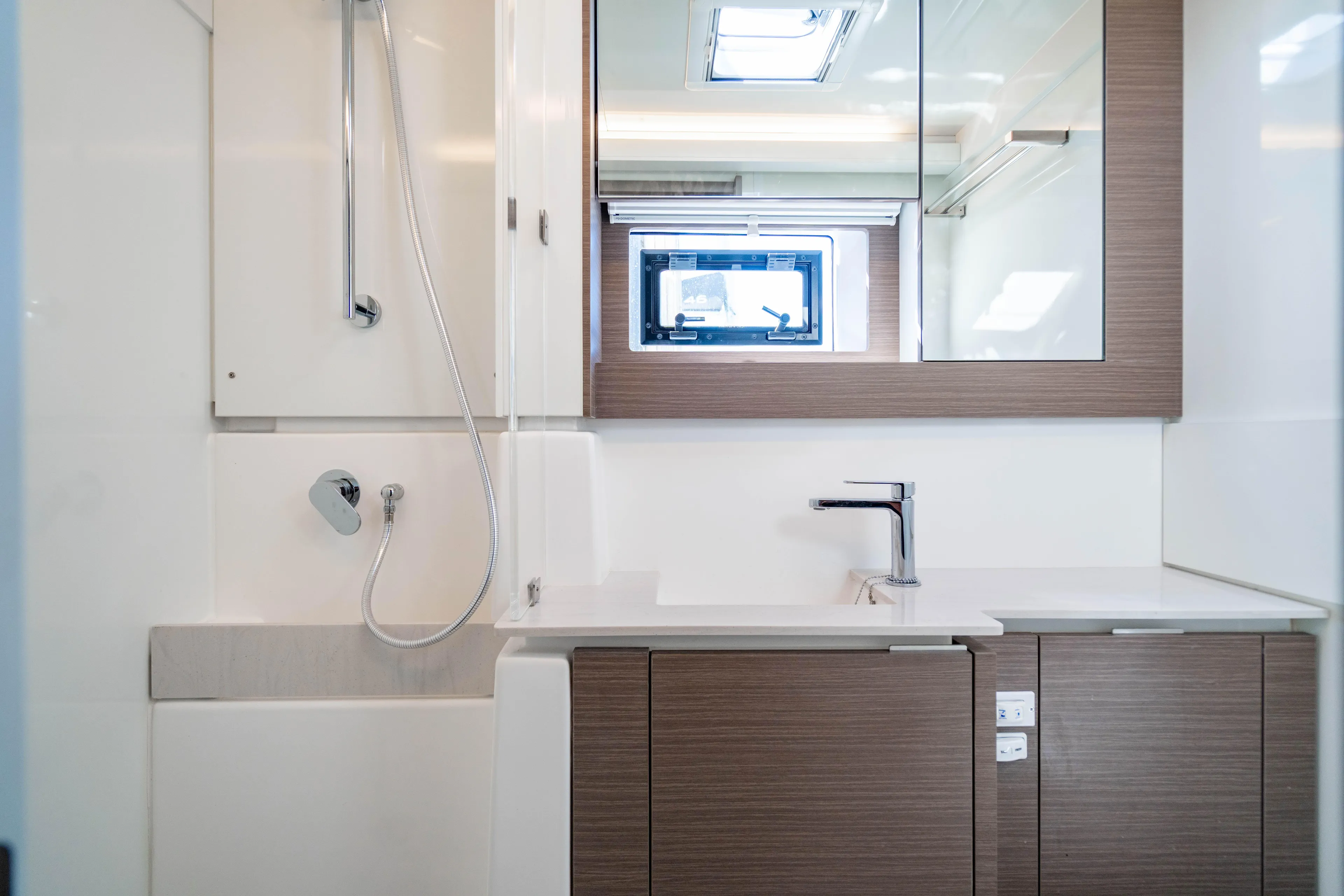 C1022 Yacht Photos Pics Modern bathroom in 2025 Leopard 46 yacht with sleek fixtures and wood accents.