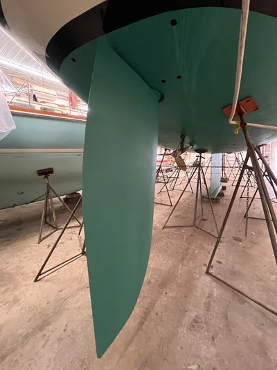 Nala Yacht Photos Pics 2004 Lyman-Morse Sparkman & Stephens Sloop in dry dock, showcasing its keel and rudder.