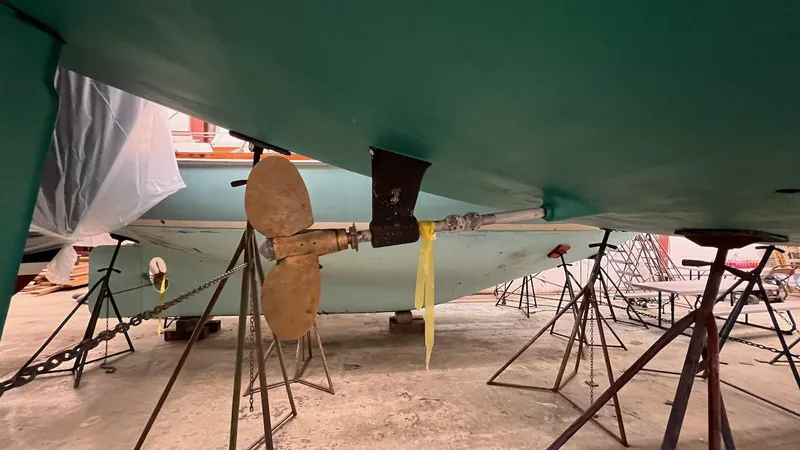 Nala Yacht Photos Pics 2004 Lyman-Morse Sparkman & Stephens Sloop under maintenance, showing propeller and hull.