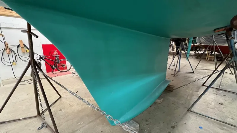 Nala Yacht Photos Pics Lyman-Morse Sparkman & Stephens Sloop 2004 keel in a workshop setting.