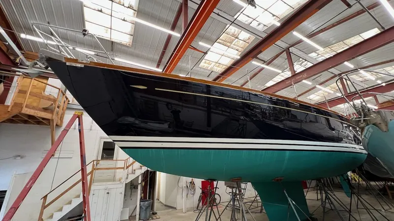 Nala Yacht Photos Pics Lyman-Morse Sparkman & Stephens Sloop, 2004, in a boatyard, showcasing sleek design and craftsmanship.