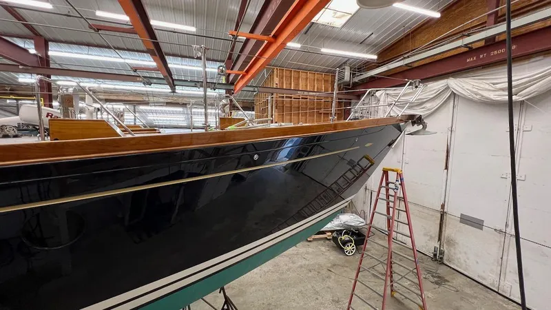 Nala Yacht Photos Pics Lyman-Morse Sparkman & Stephens Sloop, 2004, in a workshop, showing sleek hull design.