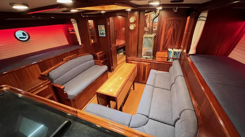 Nala Yacht Photos Pics Luxurious 2004 Lyman-Morse Sparkman & Stephens Sloop interior with elegant wood finish and cozy seating.