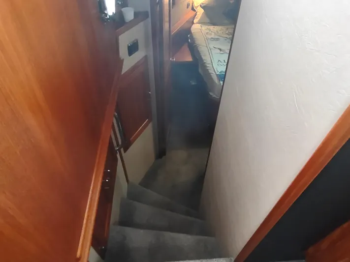 Salish Nomad Yacht Photos Pics Staircase leading to cabin interior of 2007 American Tug 34 boat.