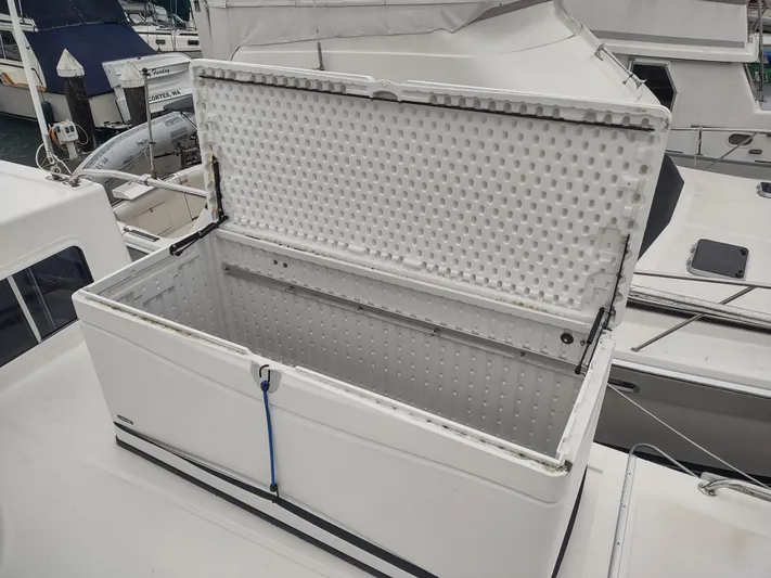 Salish Nomad Yacht Photos Pics Open storage compartment on 2007 American Tug 34 boat deck.