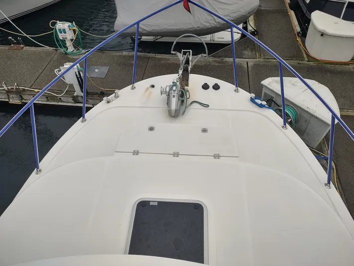 Salish Nomad Yacht Photos Pics 2007 American Tug 34 boat deck with railing and anchor.