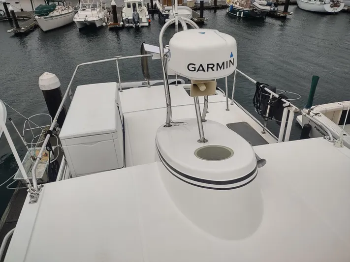 Salish Nomad Yacht Photos Pics 2007 American Tug 34 with Garmin radar on deck, docked at marina.