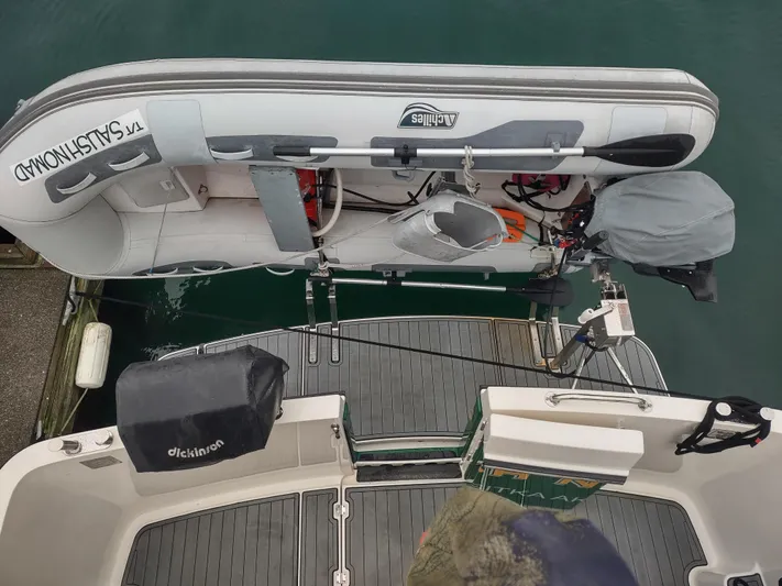 Salish Nomad Yacht Photos Pics 2007 American Tug 34 with attached inflatable dinghy on deck.