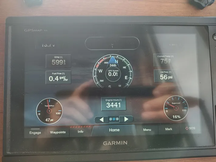 Salish Nomad Yacht Photos Pics Garmin GPS display on 2007 American Tug 34 showing engine and navigation data.