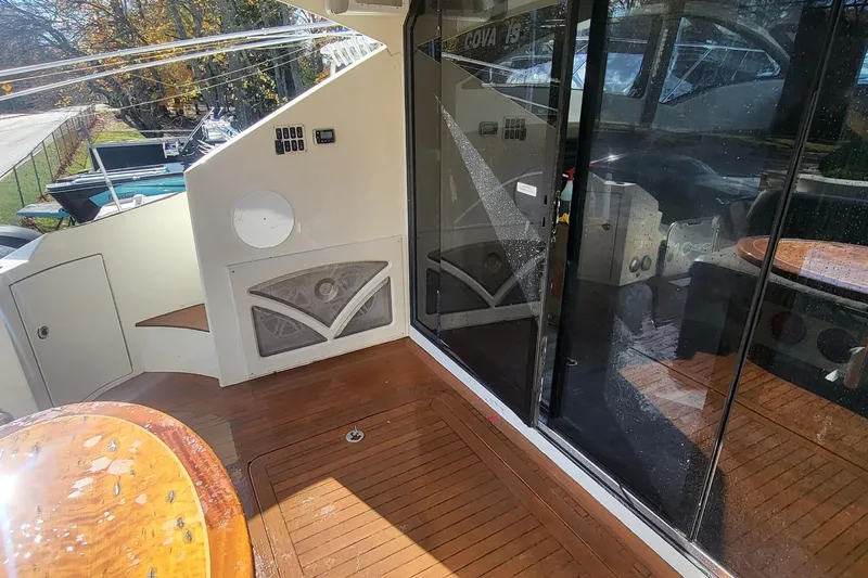  Yacht Photos Pics 2008 Marquis 40 SC yacht deck with wooden flooring and glass doors.